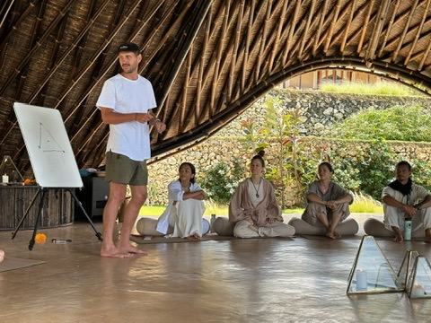 Rory teaching with a whiteboard at a Bali retreat