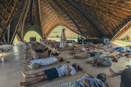 A full room resting under a bamboo dome at the end of an immersion